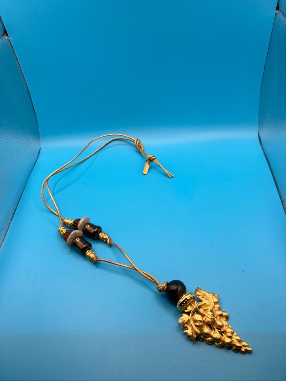 Gold-Tone Leaf Cluster Necklace with Brown Bead Accents